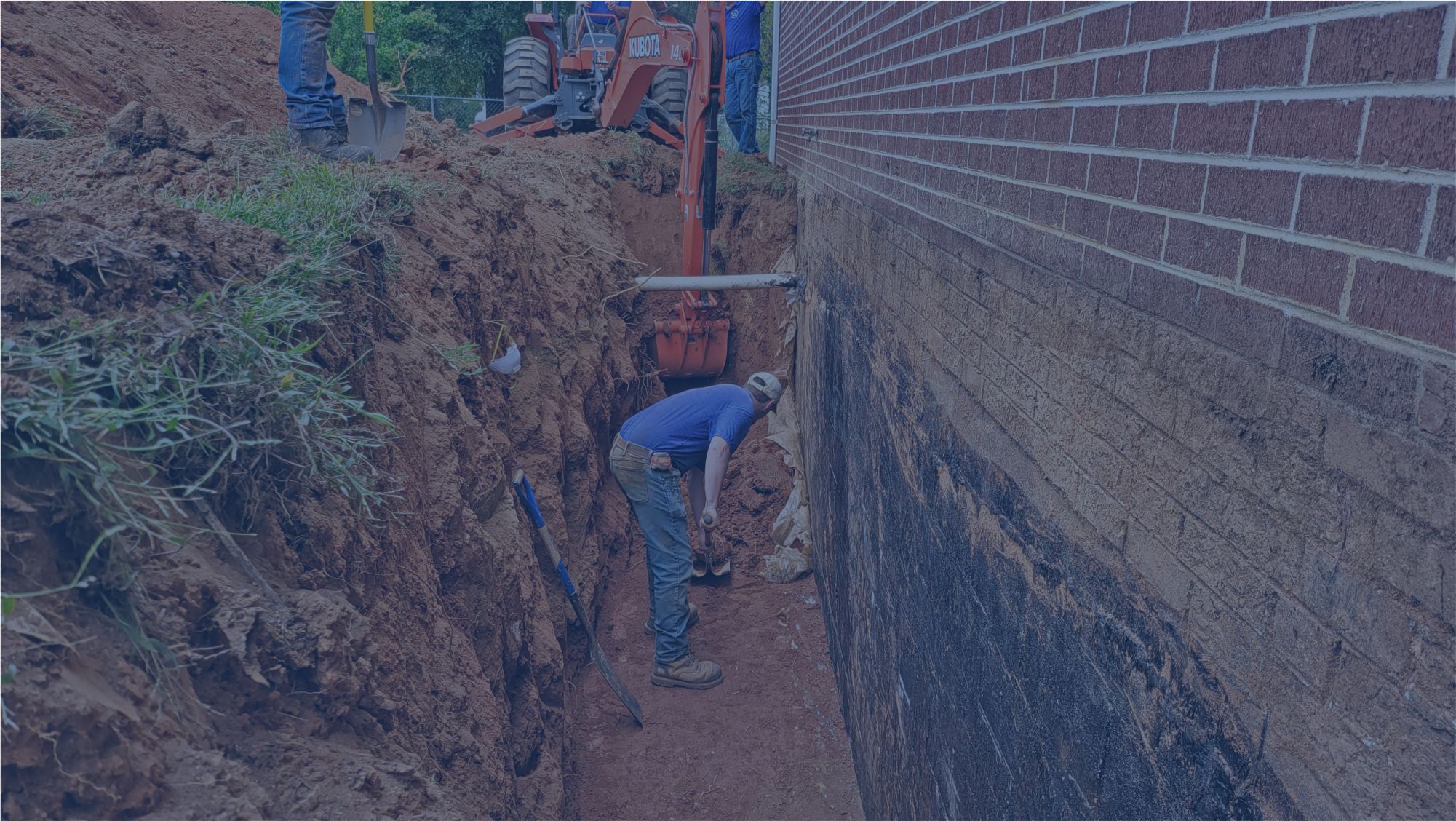Man doing waterproofing for basement walls in Hickory, NC.